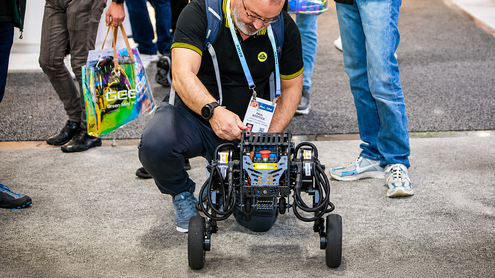Direct Drive Tech demonstrates its direct-drive wheeled-legged robot platform at CES 2024, highlighting obstacle-crossing ability, agility, efficiency, and industrial application potential.